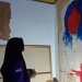 Pamera lukisan korban kekerasan seksual di Jambi. (ANTARA/HO/Irma)