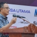 Kepala Dinas Peternakan Aceh Zalsufran, saat membacakan sambutan Penjabat Gubernur Aceh, pada Musyawarah Anggota PDHI Cabang Aceh, di Aula Amel Convention Center, Sabtu (21/1/2023). (Dok. Humas Pemerintah Aceh)