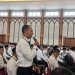 Saifullah asal Aceh dalam diskusi simulasi kasus haji, Rabu (12/4/2023). (Foto: Alibi/Dok. Kemenag Aceh)