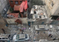 Foto udara menunjukkan bangunan dan mobil yang hancur pasca serangan Israel di Rafah, Gaza, Palestina, Jumat (9/2/2024). (Foto: Dok. Antara/Anadolu Agency/aa)