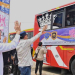 Menteri Perhubungan (Menhub) Budi Karya Sumadi (dua kiri) melambaikan tangan kepada sejumlah peserta mudik gratis yang berada di dalam bus di Terminal Jatijajar, Depok, Jawa Barat, Sabtu (6/4/2024). (Foto: Dok. Antara/HO-Humas Kemenhub)